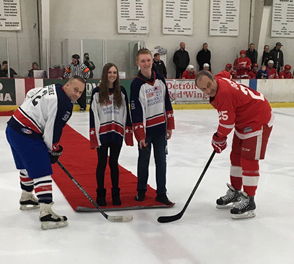 Hockey players with hockey sticks